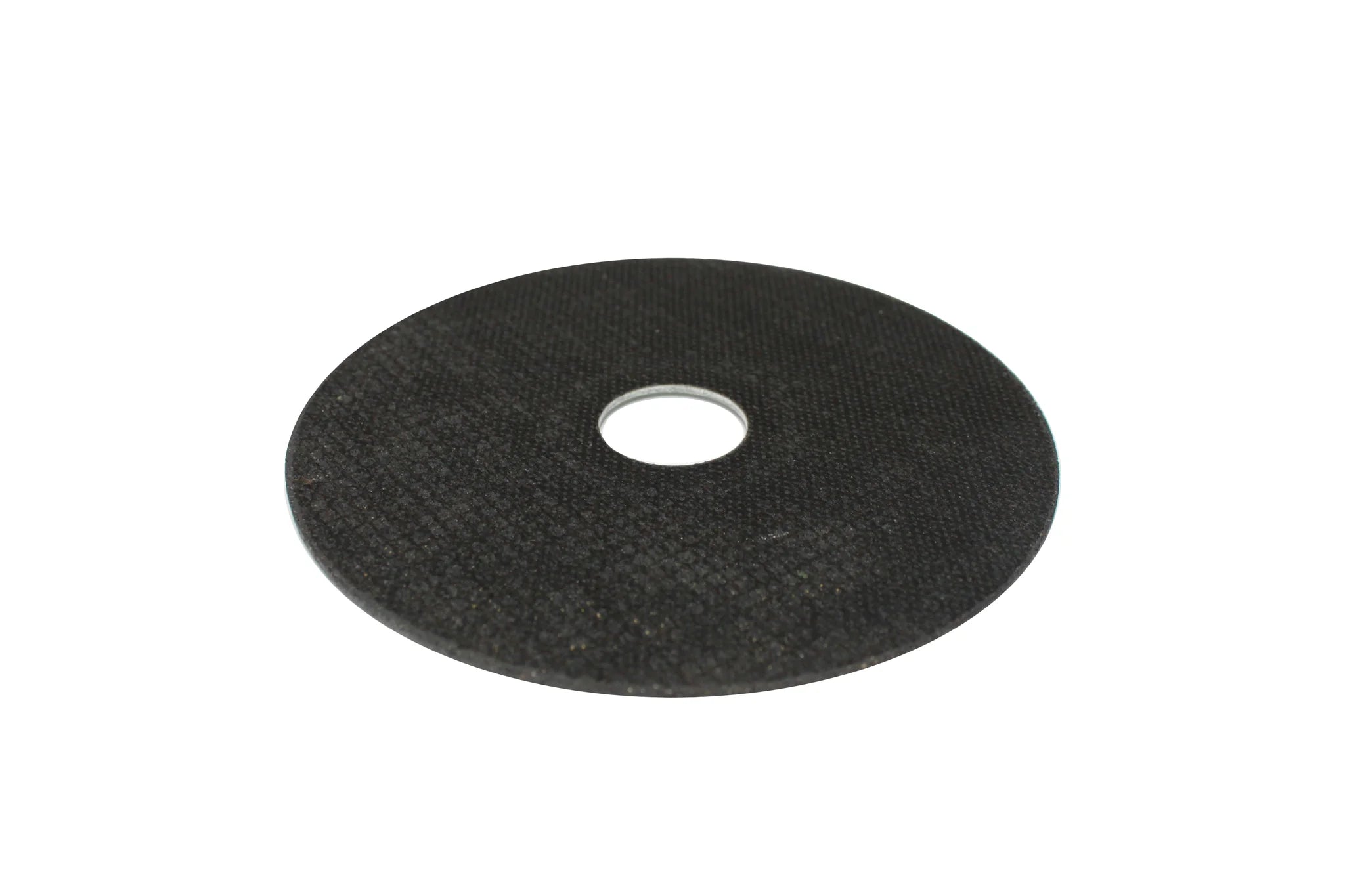 Back side of Caliastro 4.5-inch cut off wheel showing abrasive surface and grit texture