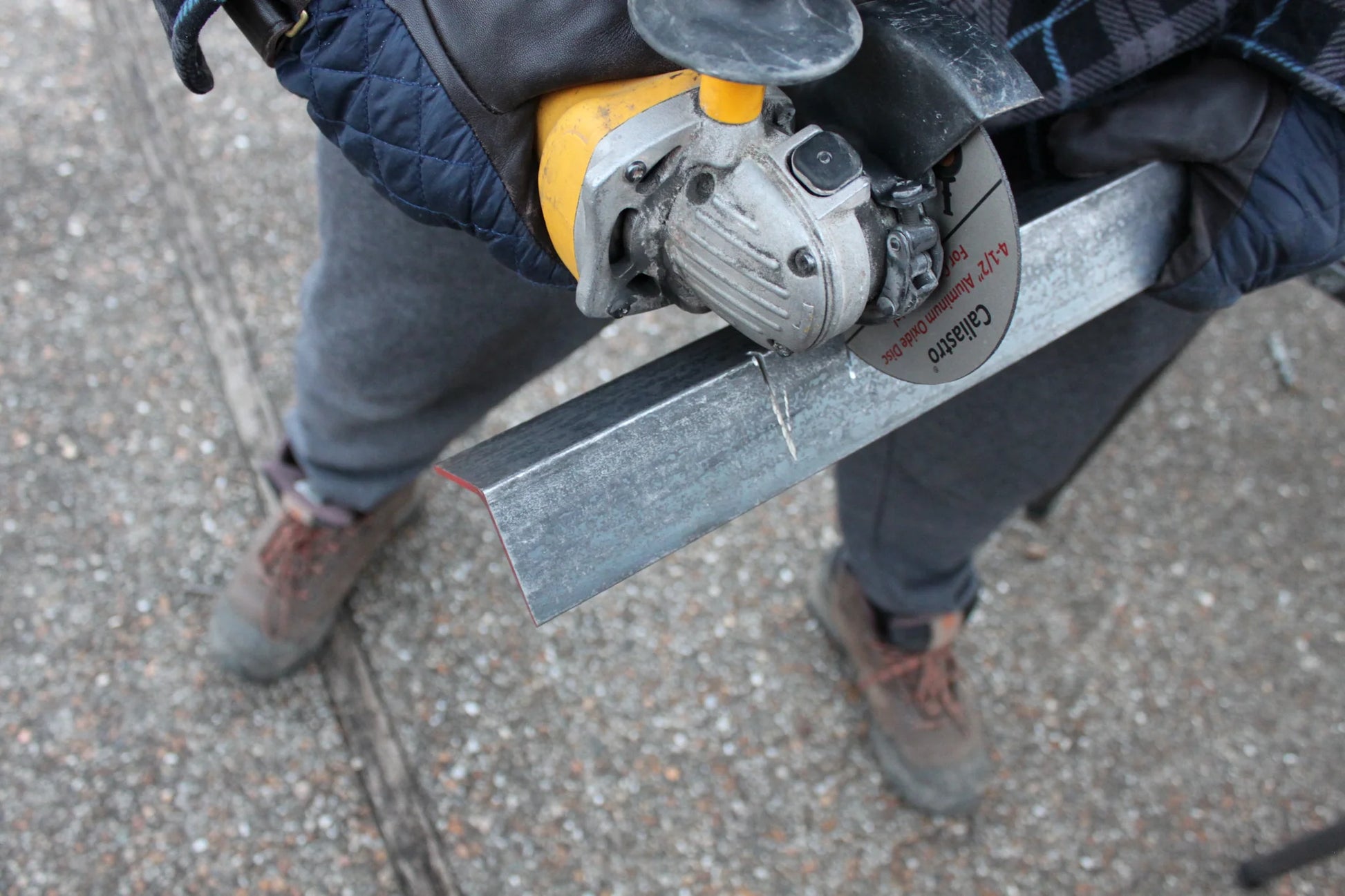Caliastro cut off wheel grinding through masonry block using angle grinder