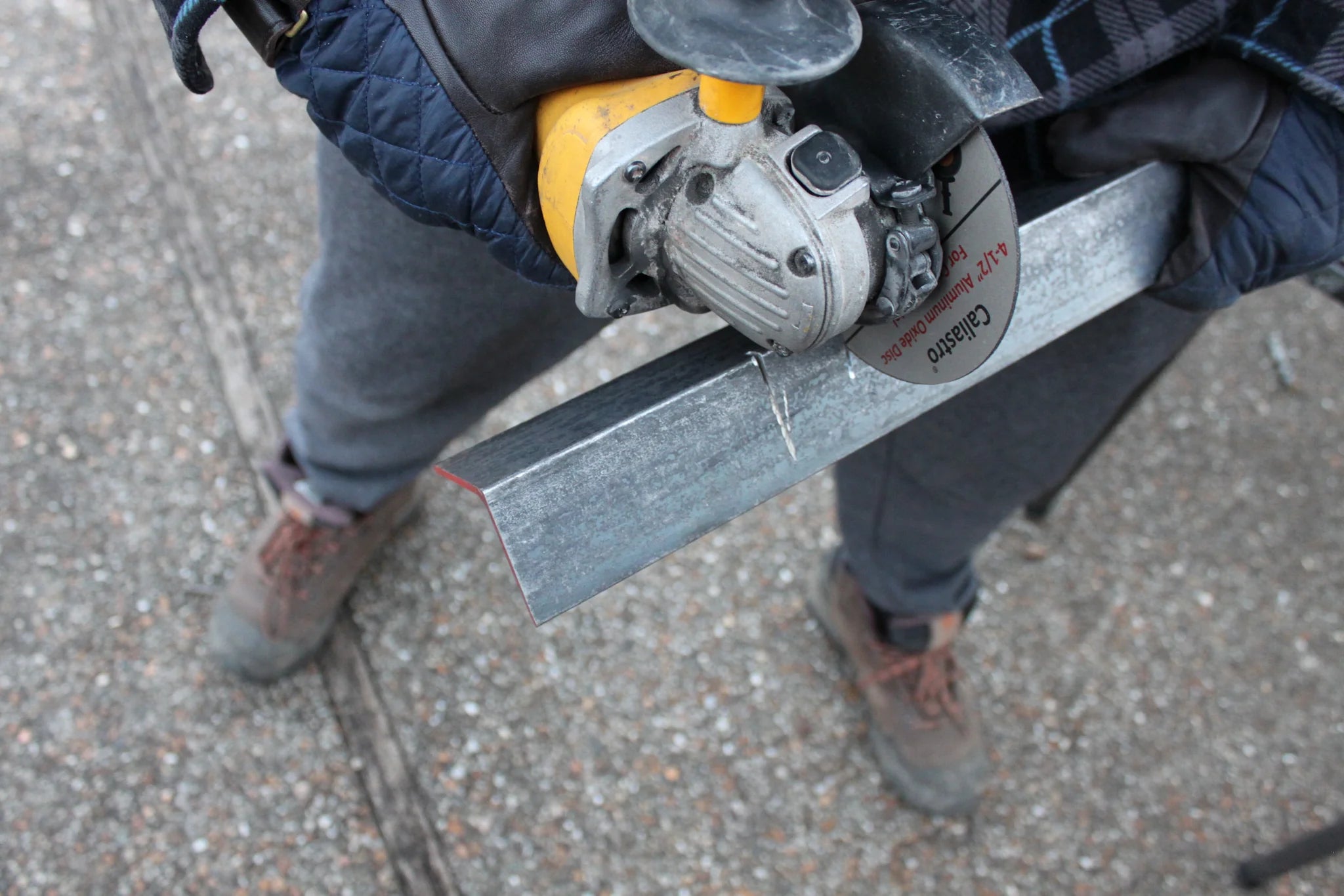 Caliastro cut off wheel grinding through masonry block using angle grinder