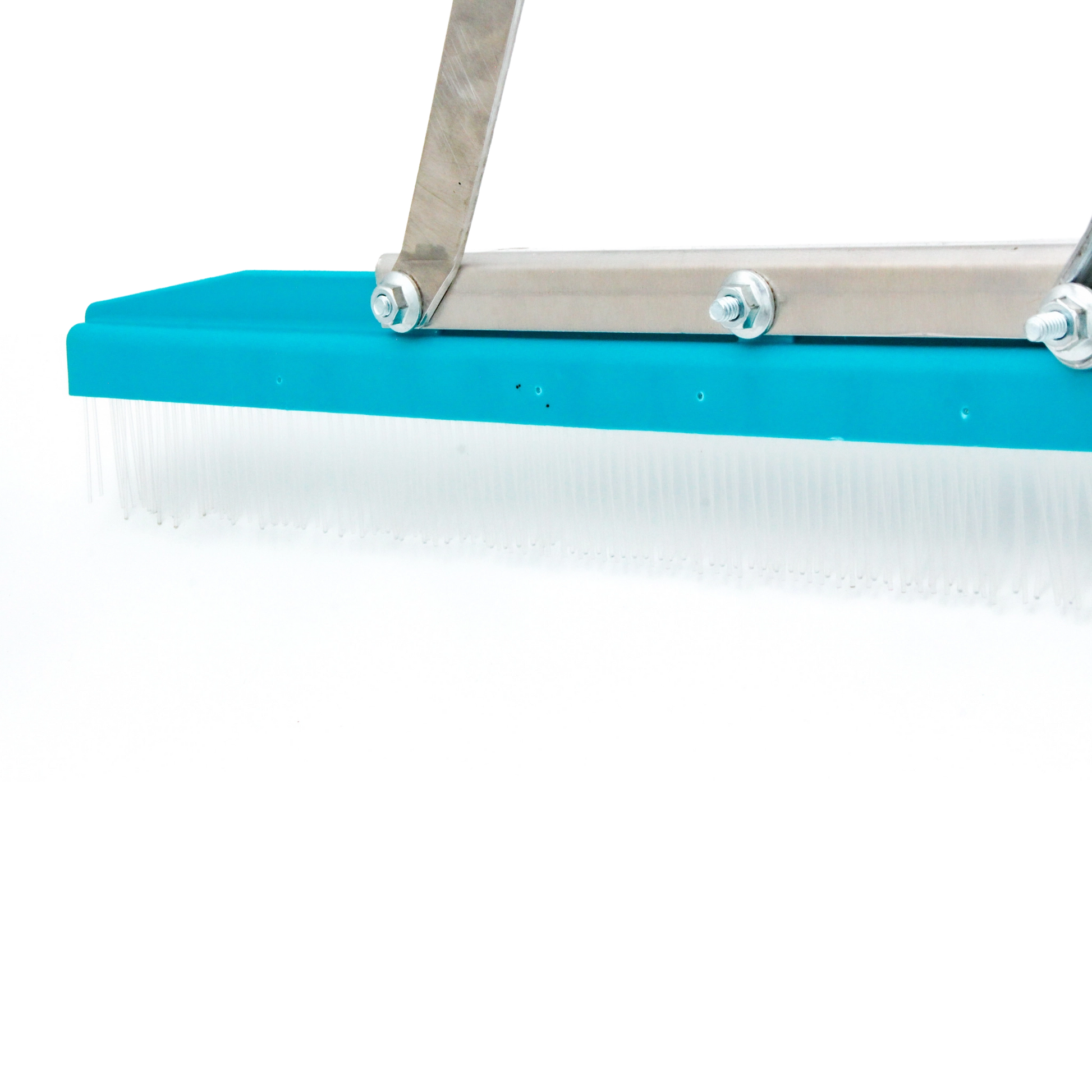 zoomed in on left edge of rake showing end of grooming head and tine detail