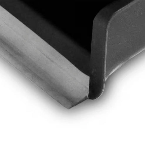 Rubber lip on Libman dust pan ensuring seal with floor