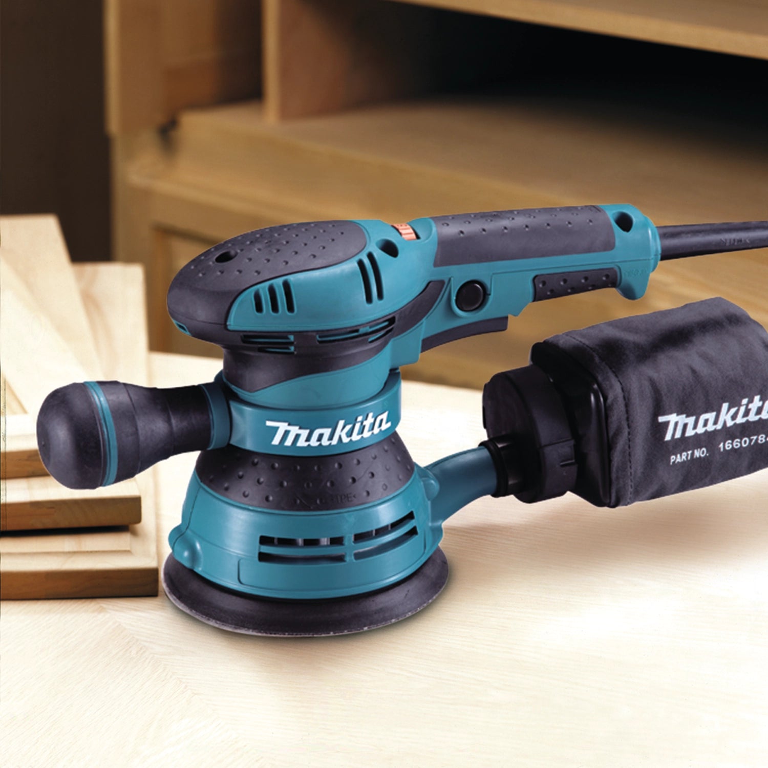 close-up of makita orbit sander on jobsite sanding wood with precision
