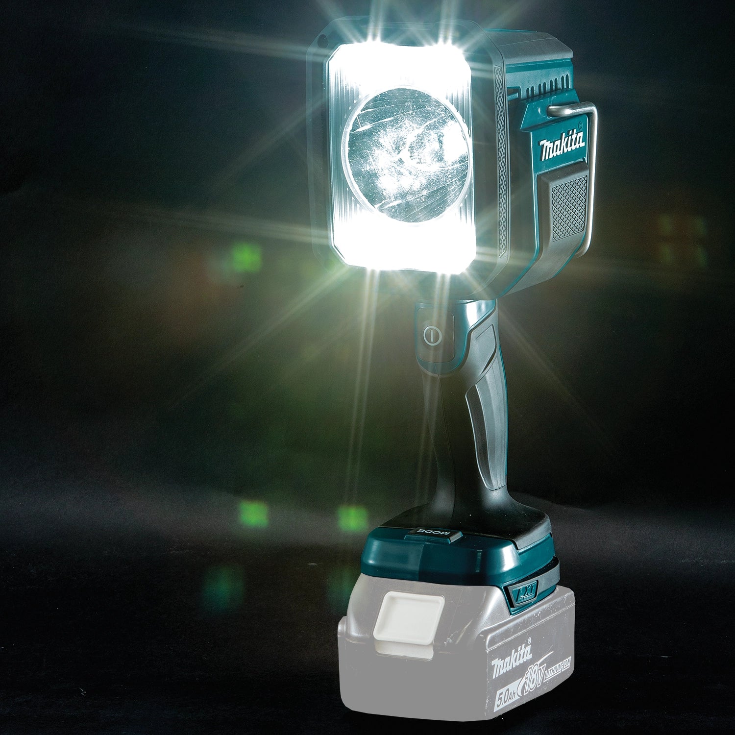 Makita DML812 spotlight turned on in a pitch-black setting