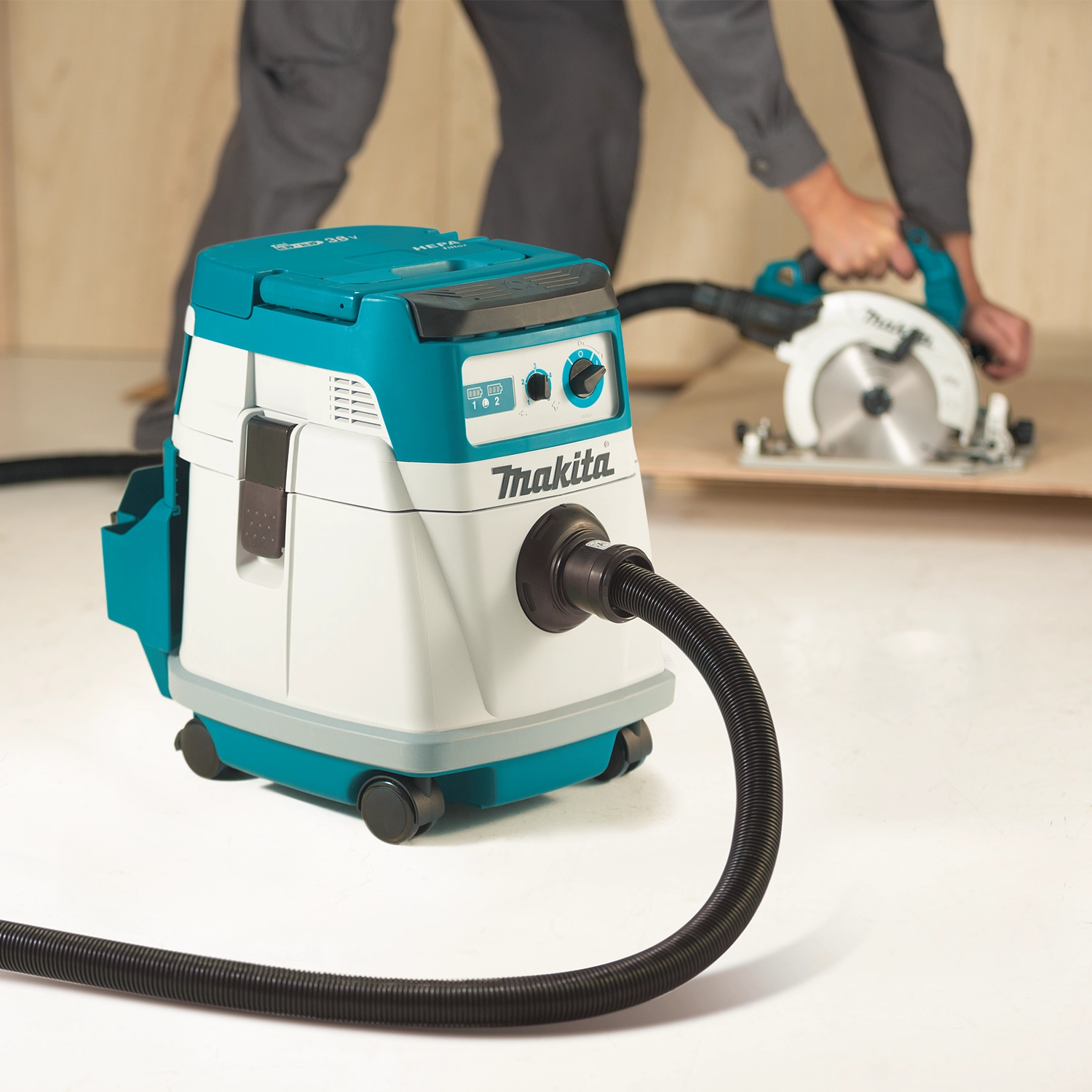 makita 36v dust extractor on job collecting debris during sanding and cutting