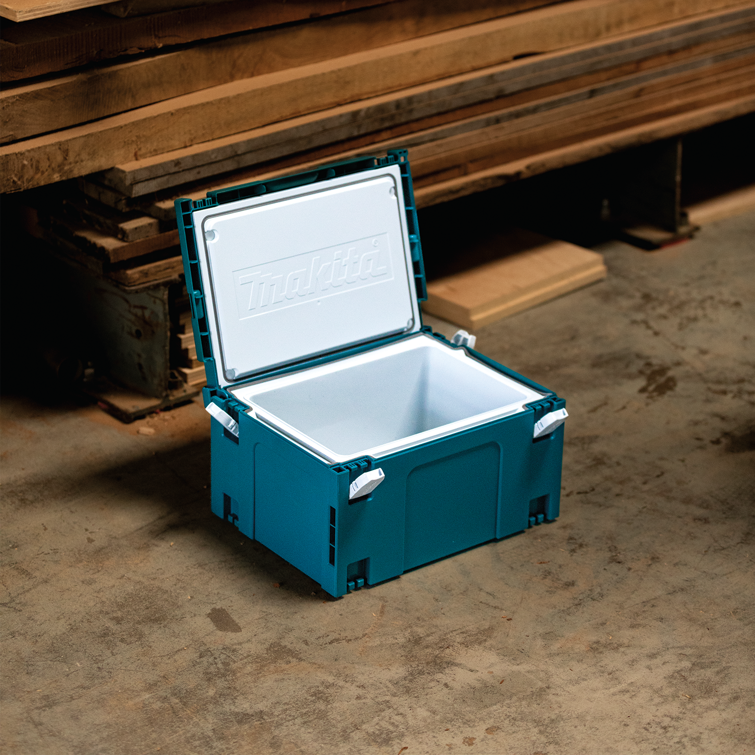open makita cooler box placed on jobsite with visible contents