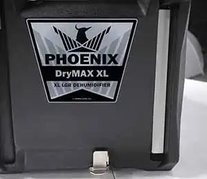 Close-up of Phoenix DryMAX XL Red Dehumidifier access panel for filter maintenance and hose connection