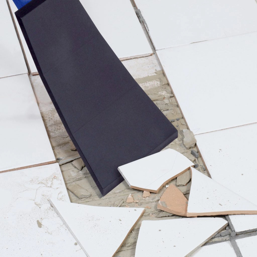 QEP demolition scraper in use removing ceramic tile during floor demo