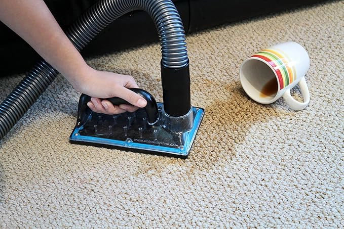 SOS sub surface extraction tool cleaning coffee spill from carpet with visible extraction