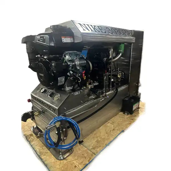 Steamaction Nike 3030 truckmount carpet cleaning system with visible dual vacuum motors, stainless steel housing, and control gauges on display.