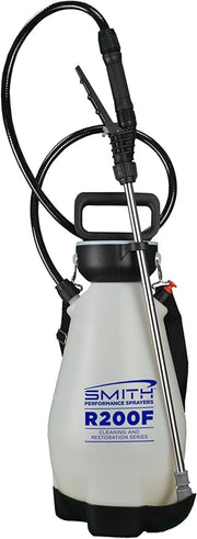 White pressure washer with black hose and nozzle on a white background