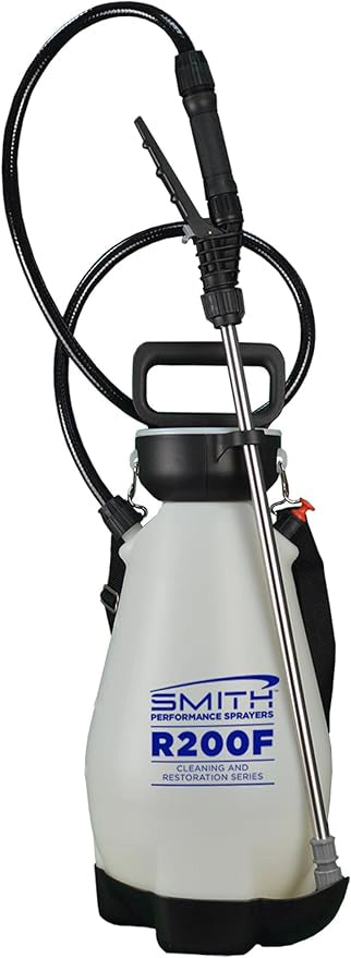 White pressure washer with black hose and nozzle on a white background