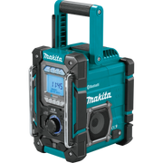 angled view of makita 18v lxt radio charger showing rugged design and controls
