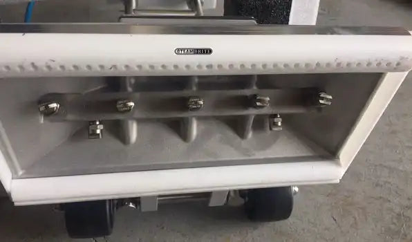 Bottom of Bonzer extractor shown on carpet in operating position
