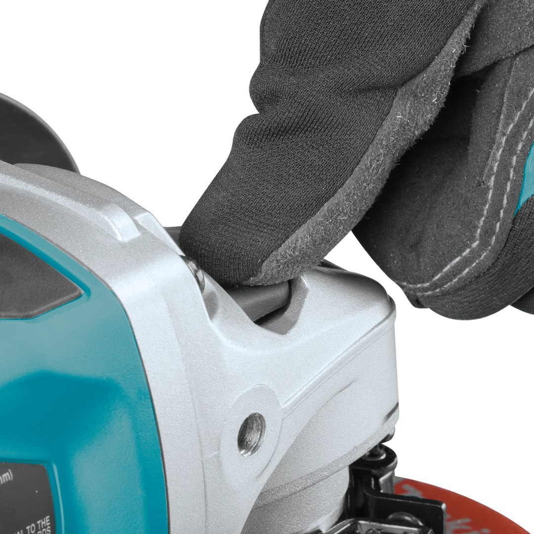 close up of makita 5 inch grinder lock on button and paddle switch
