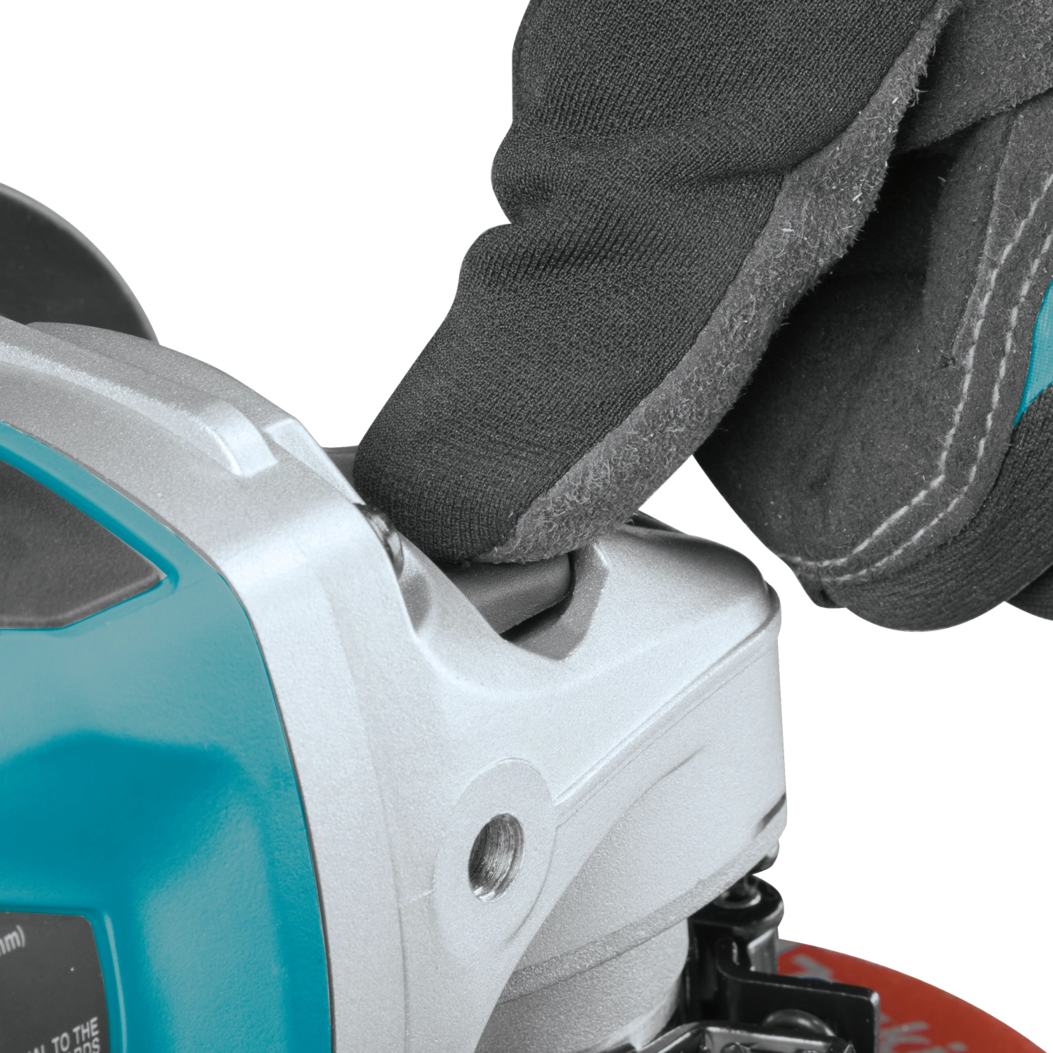 close up of makita 5 inch grinder lock on button and paddle switch

