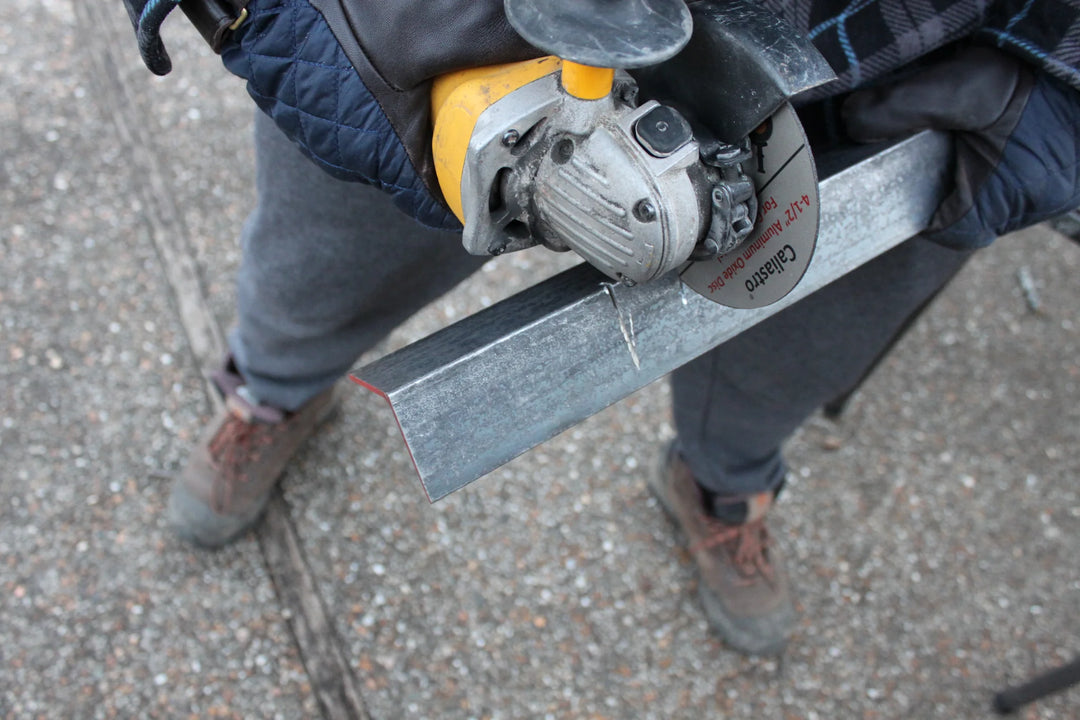Caliastro cut off wheel grinding through masonry block using angle grinder
