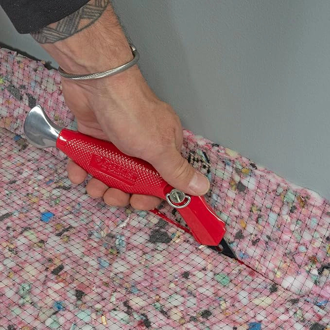 Cut & Jam carpet knife used to slice carpet padding with precision
