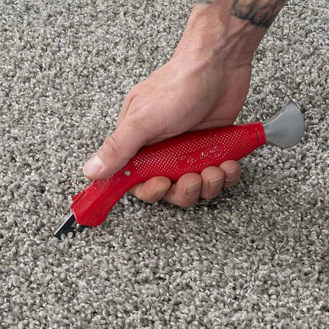 Cut & Jam carpet knife cutting through carpet with clean, straight edge
