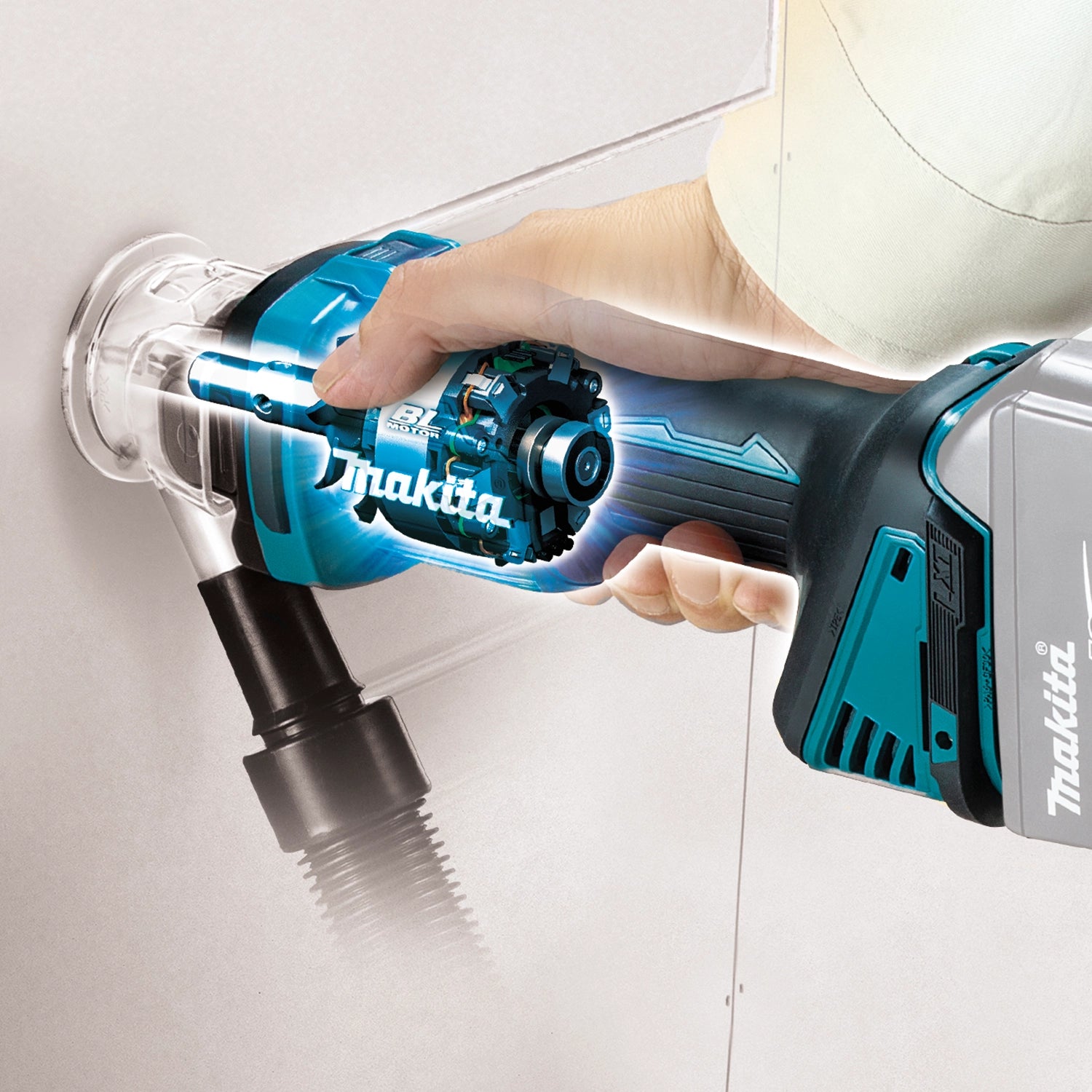 makita xoc02z cut-out tool cutting drywall during wall panel installation
