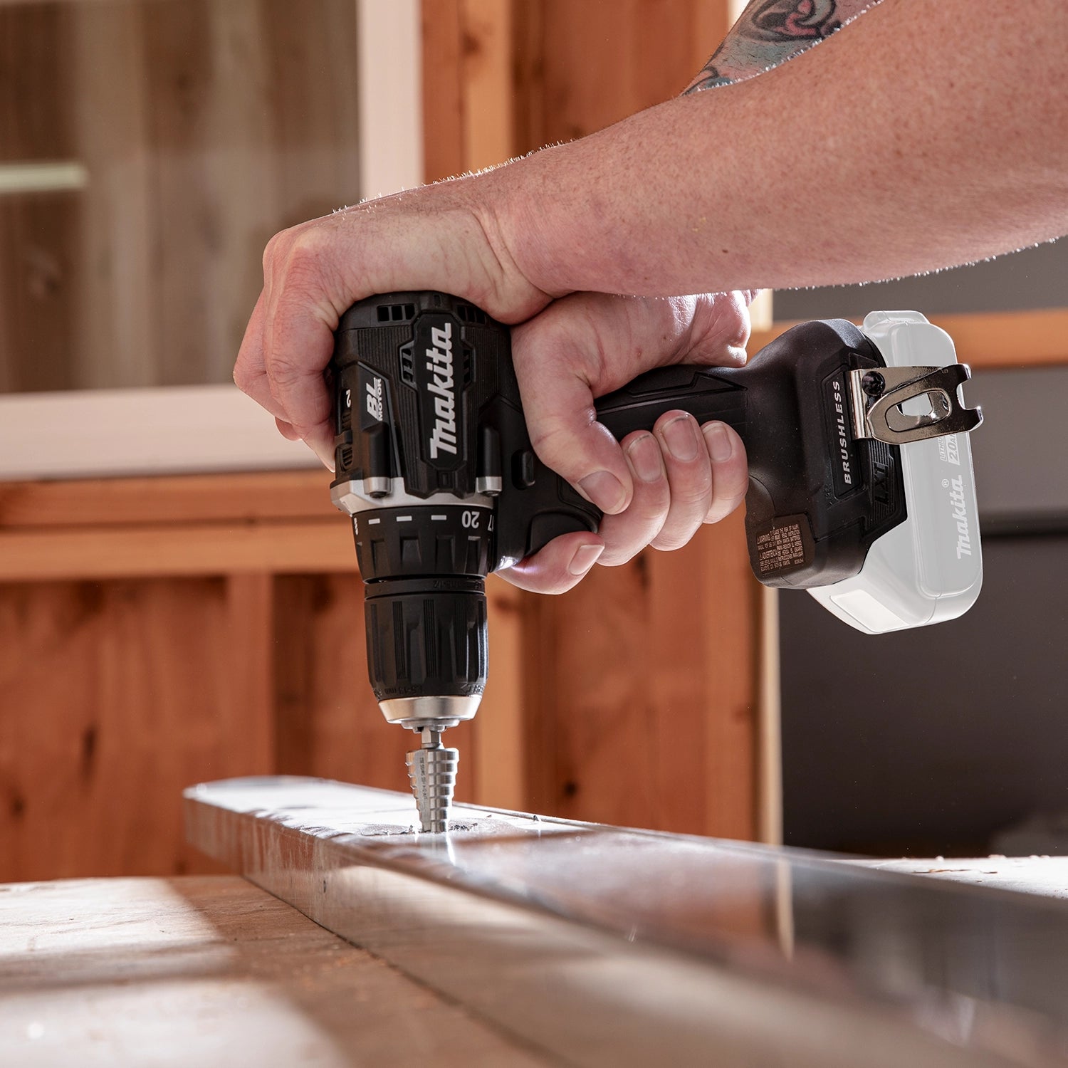 makita sub compact drill drilling downward into surface material
