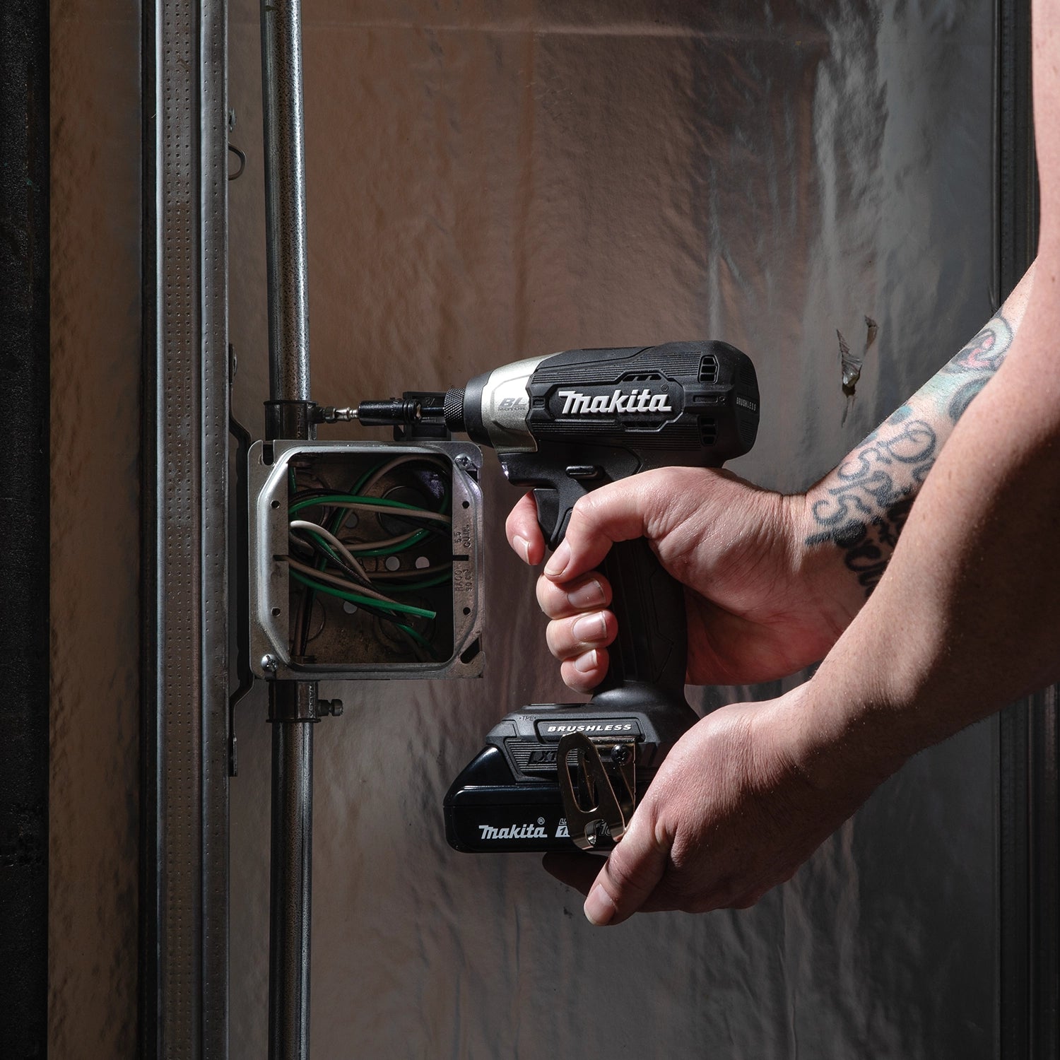 makita 18v lxt sub-compact drill in action on job site driving screws into wood
