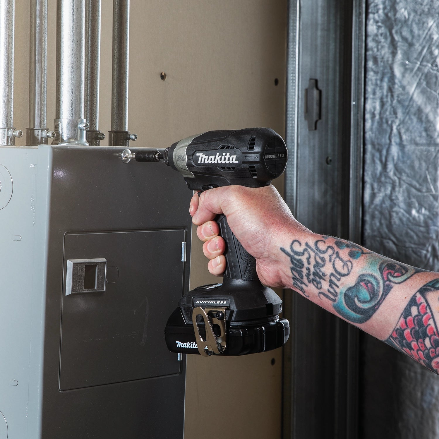 alternate view of makita sub-compact drill being used for job site fastening task
