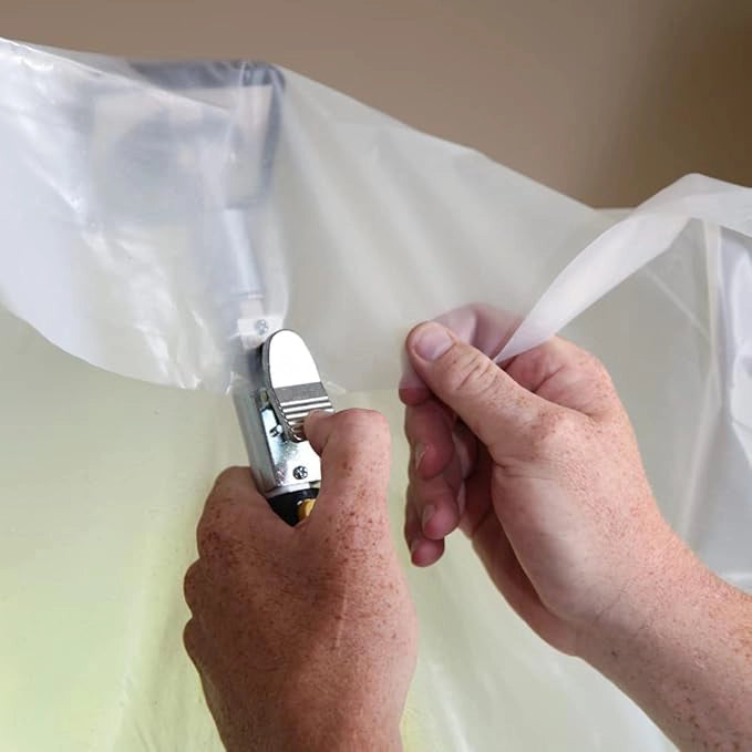 E-Z UP pole clip securely fastened to clear sheeting for dust containment
