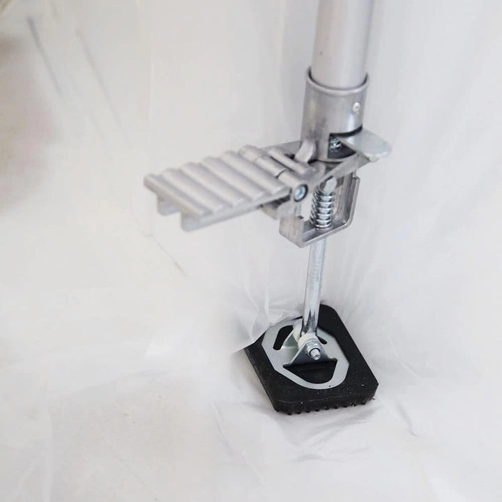 Bottom foot plate of E-Z UP pole showing anti-slip base for stable support
