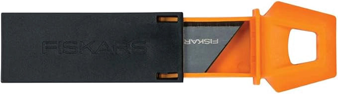 Fiskars utility knife fully extended with CarbonMax blade exposed for cutting
