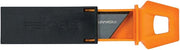 Fiskars utility knife fully extended with CarbonMax blade exposed for cutting
