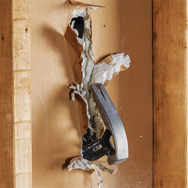 User breaking drywall with the sledge side of the Fiskars IsoCore tool
