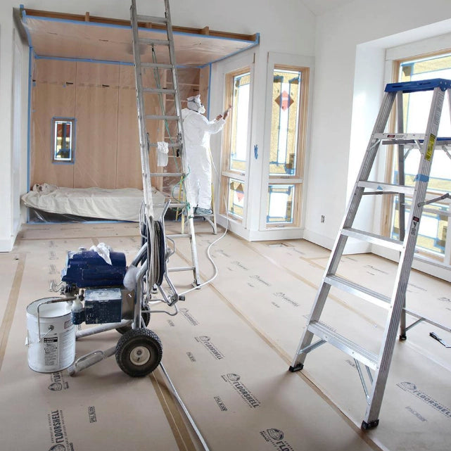 Ladder positioned on top of Trimaco FloorShell-covered flooring
