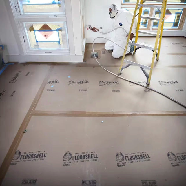 Trimaco FloorShell taped down at seams for secure surface coverage
