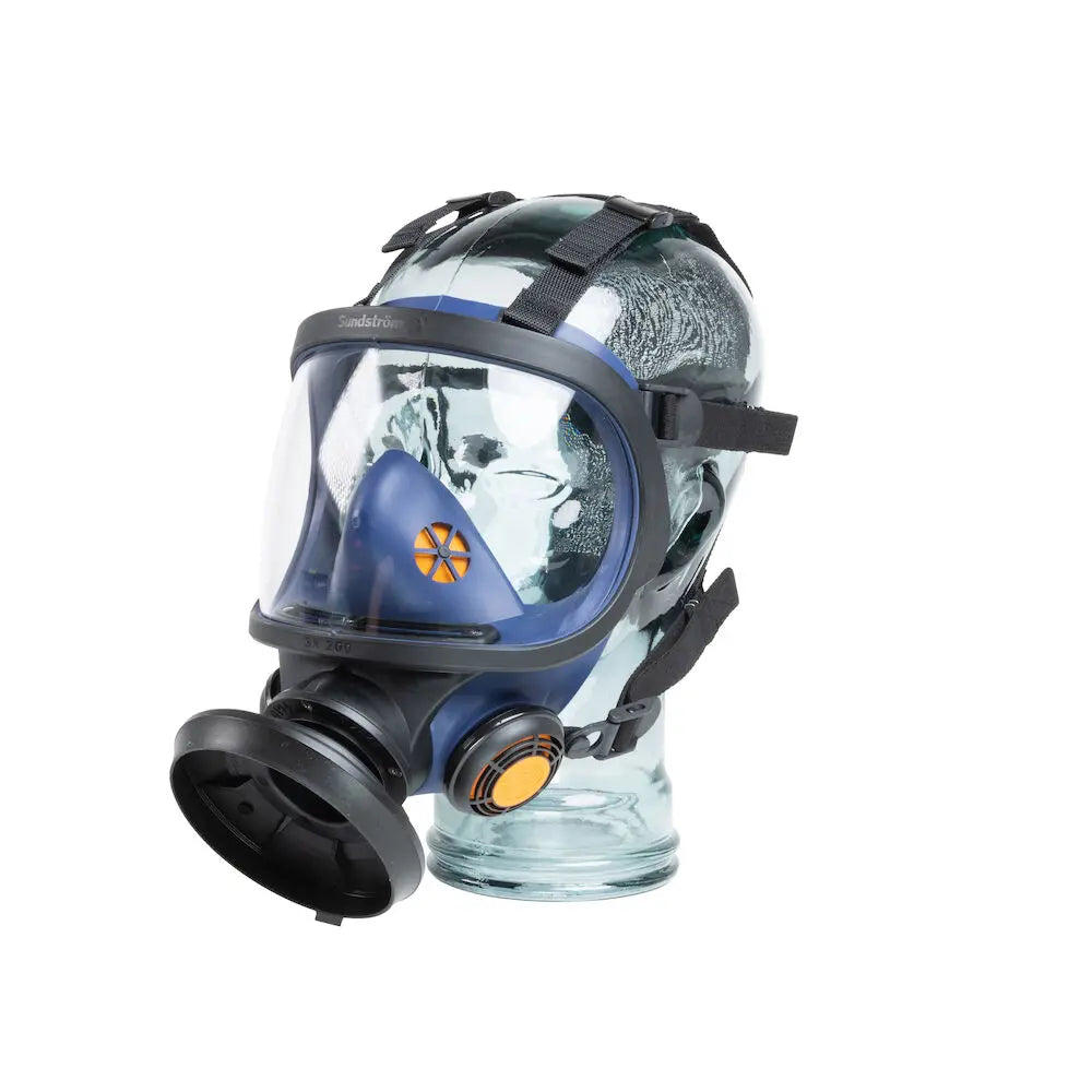 Front right angle of Sundstrom SR 200 respirator worn on head, showing lens and seal
