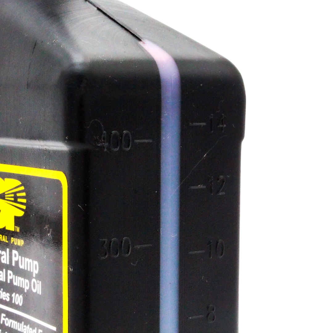 Up close view of measurement markings on side of General Pump Series 100 oil bottle
