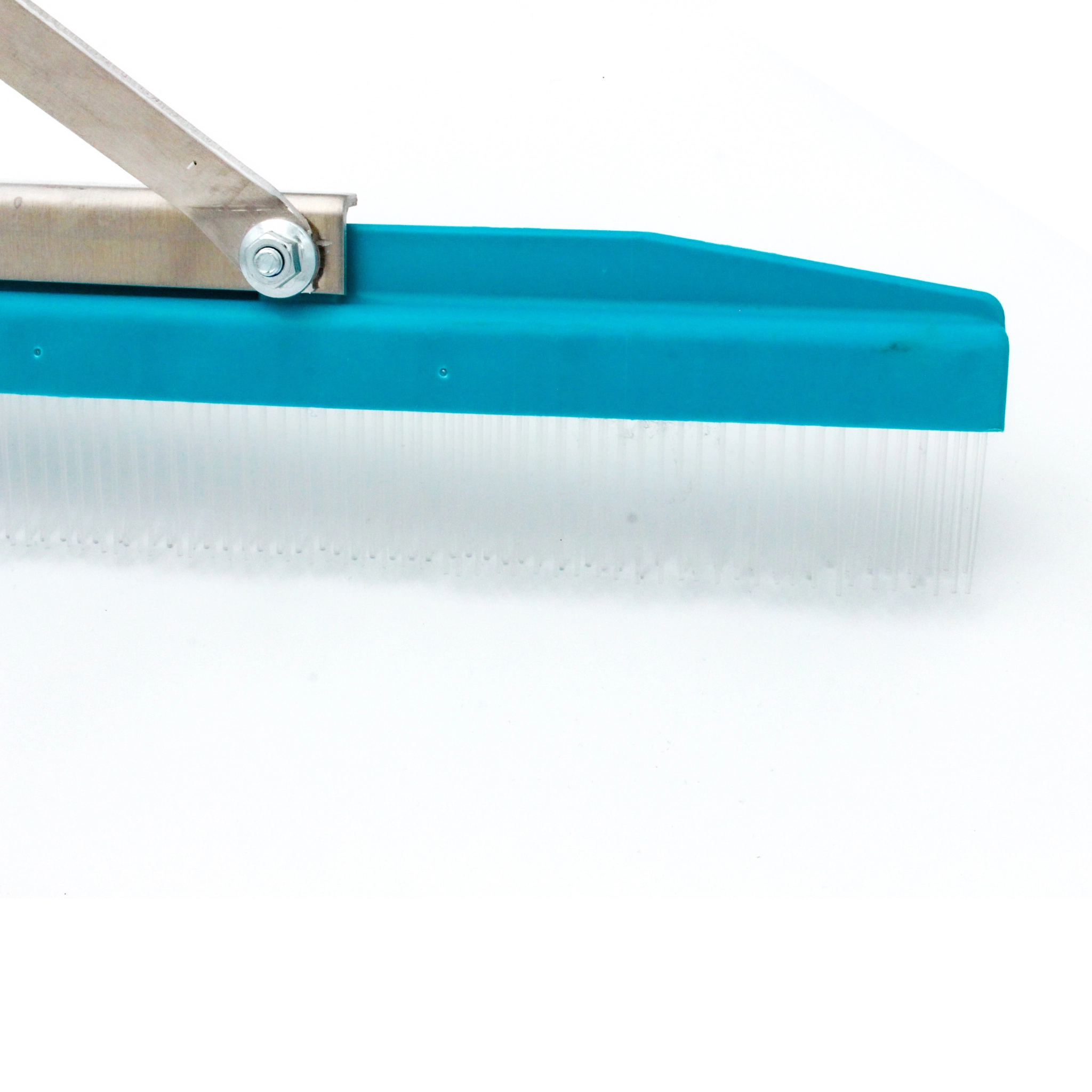 close-up of right edge of grandi groom rake showing bristle alignment
