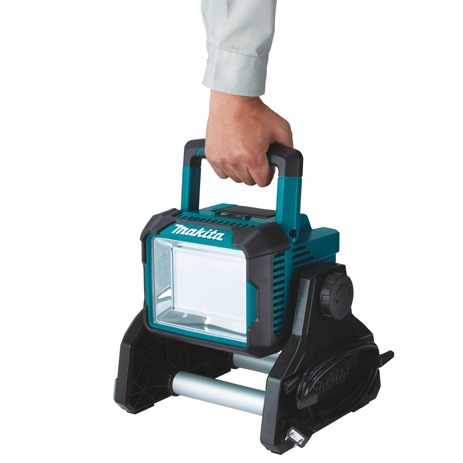 user holding makita dml811 led work light by ergonomic carry handle

