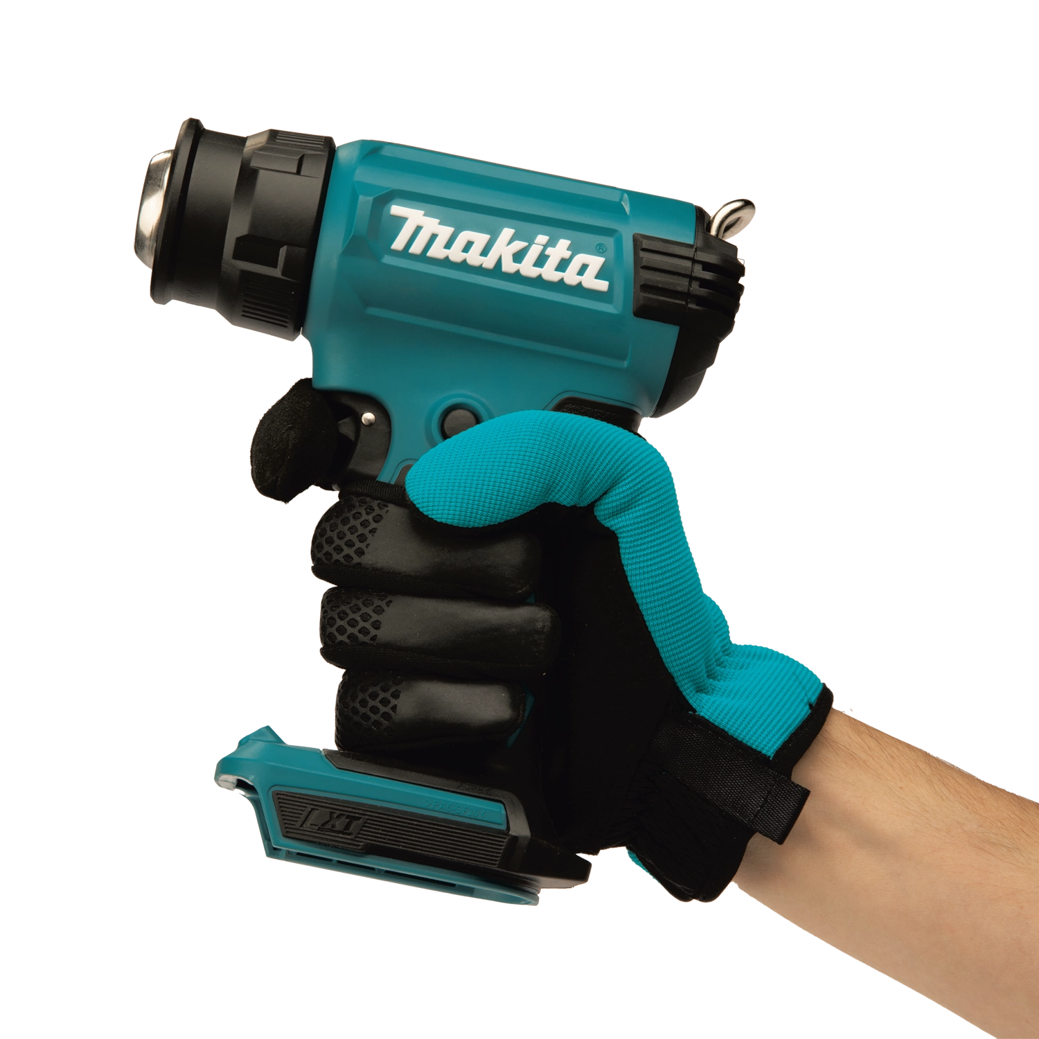 user holding makita cordless heat gun during application for hands-on control
