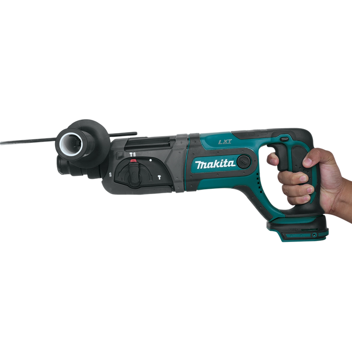 Worker holding Makita SDS-PLUS rotary hammer, ready for drilling task
