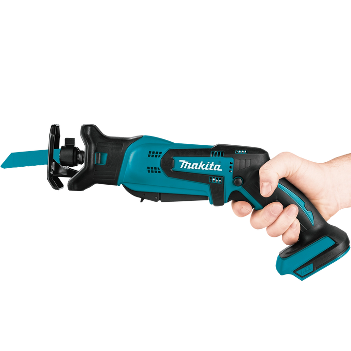 user holding makita 18v lxt compact recipro saw in ready position for cutting
