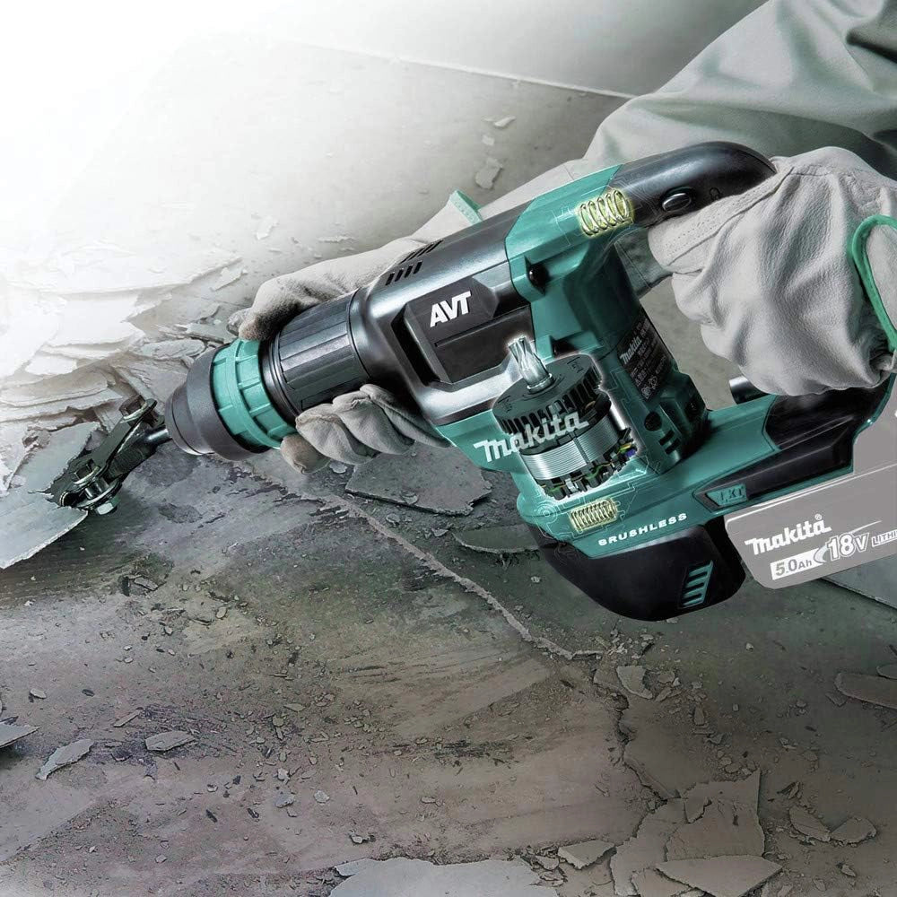 makita 18v lxt avt power scraper in use removing flooring on active job site
