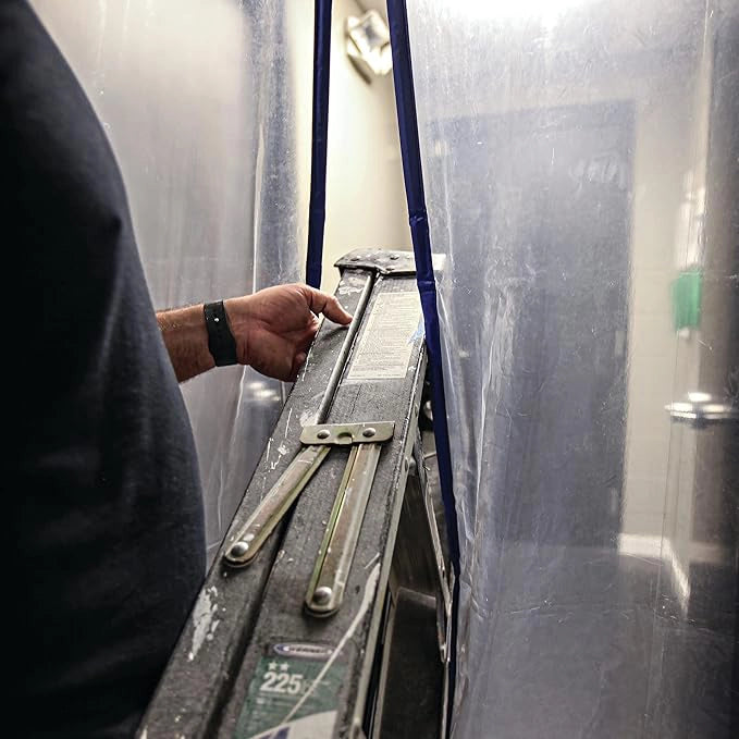 Ladder passing through magnetic dust containment door during work
