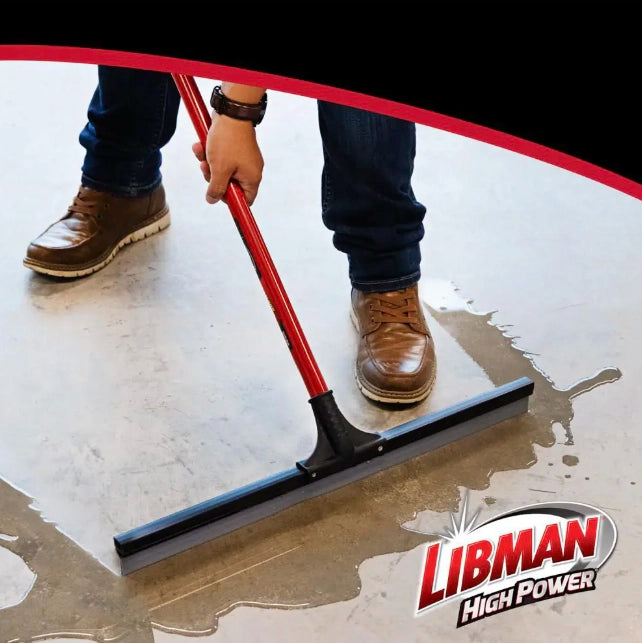 Libman squeegee in use during commercial cleanup project on hard flooring
