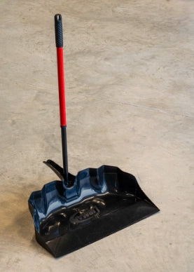 Libman outdoor scoop in use on job site collecting demolition debris
