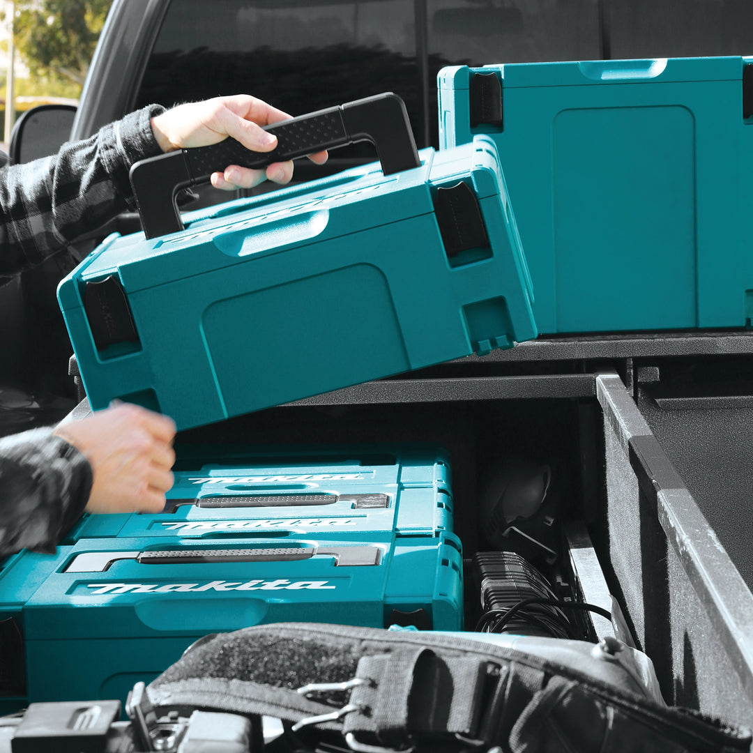 loading makita interlocking case into truck for transport
