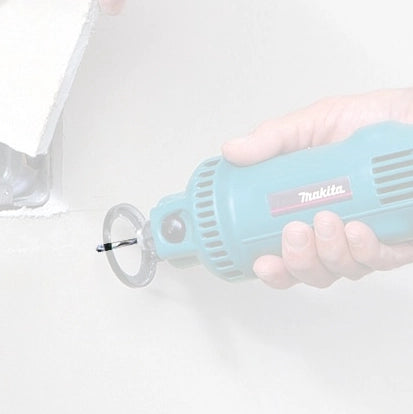 Makita 1/8" drywall guide tip bit in use with rotary tool during drywall modification
