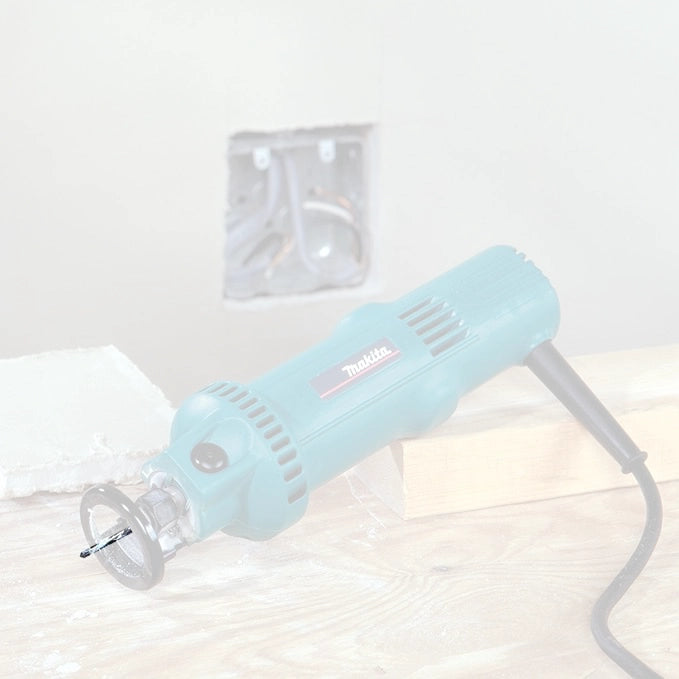 Makita 1/8" drywall guide tip bit cutting precise outlet opening in drywall
