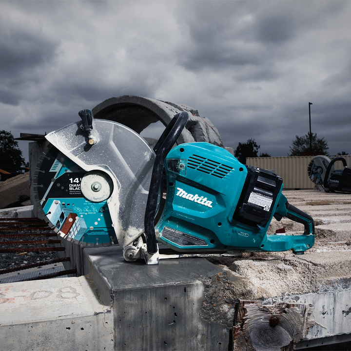 Makita 14" diamond blade mounted in a gas-powered saw, ready for cutting
