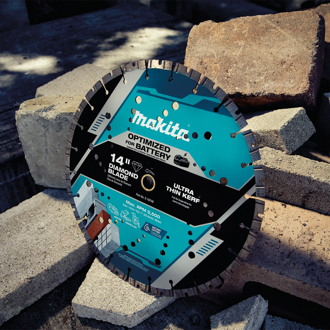 Worker using Makita diamond blade on reinforced brick wall during a construction project
