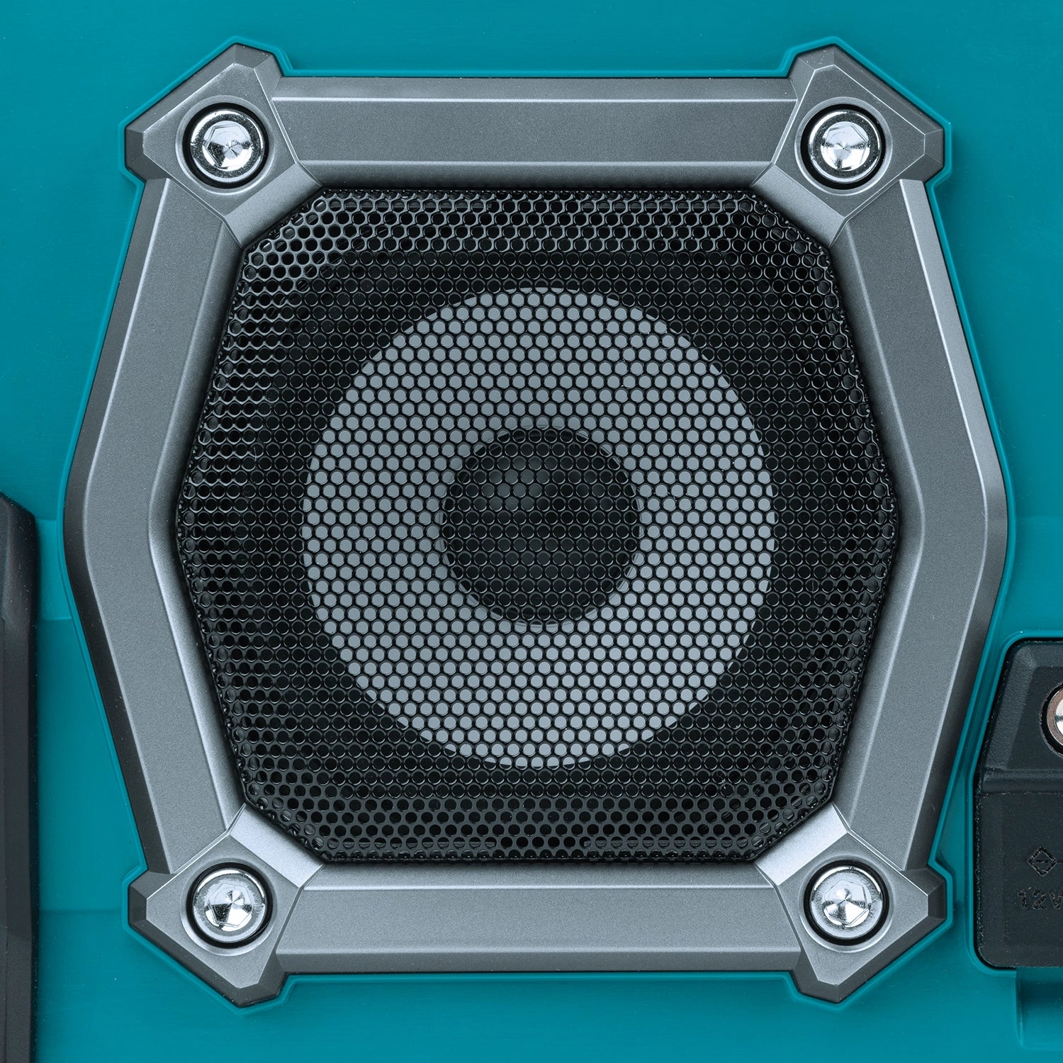 close-up of makita job site radio speaker showing grille and surround for audio output
